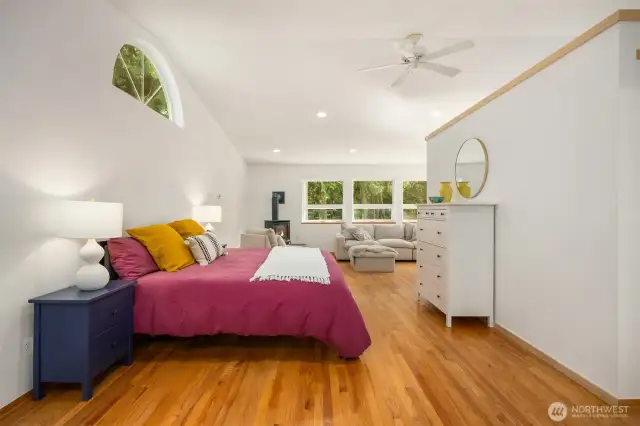 Here, another view of the primary suite, focused on the sleeping space.
