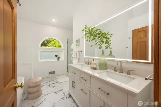 This luxurious 5-piece bathroom is conveniently located between the 2nd and 3rd bedrooms. Its large vanity offers 2 undermount sinks, a huge soaking tub, walk-in shower, lots of storage, and Toto washlet.