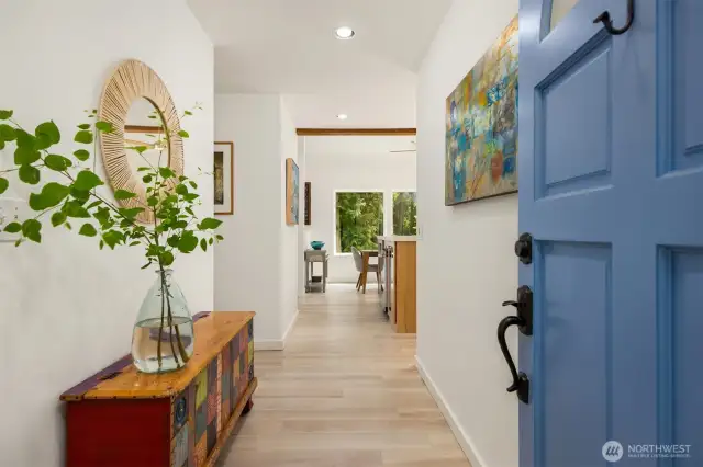 Welcome! This cheerful entry hall includes a coat closet as well as beautiful, practical, and essentially indestructible porcelain tile flooring for worry-free living.