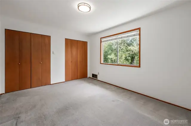 Master Bedroom With 2 double deep roomy closets. With a nice view of the Pond/Creek. You see only green lush area no neighbors. Private and relaxing.