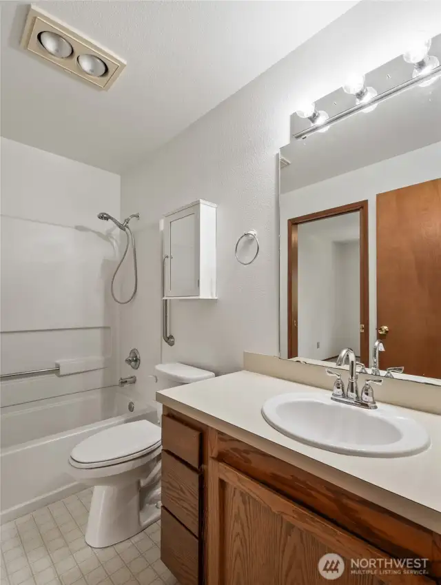 Master Full bathroom is well lit and convenient for both bedrooms.