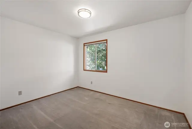 2nd Bedroom with a view of the beautiful Red Maple Tree.