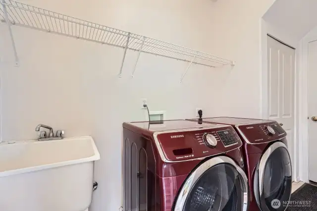 Utility room with newer washer/dryer and sink