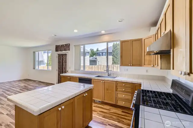 Kitchen with newer range and upgraded hood vent