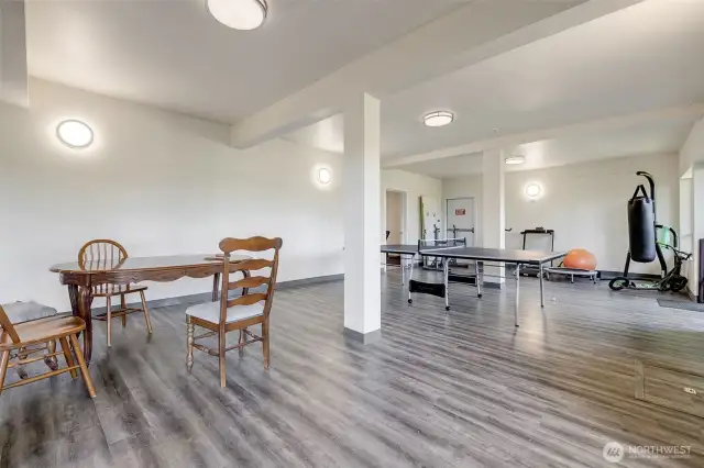 A ping-pong match, or a birthday gathering, the shared space downstairs has room for it all — and maybe a new neighbor-friend too!