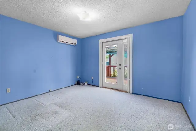 Bedroom #1 w/door to deck in backyard