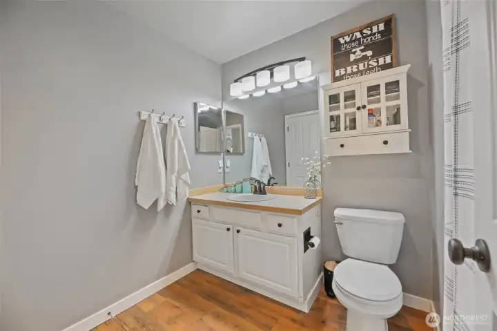 You can access the bathroom from the hall or from the primary bedroom.