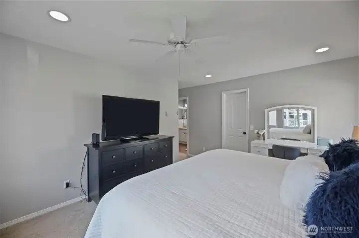 Walk in closet off primary along with access to the bathroom.