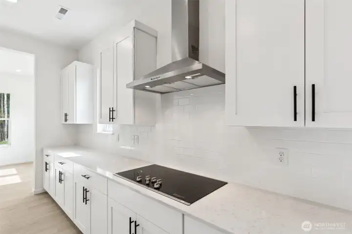 ***Actual Home *** Hood is set in a subway tile and home has GE Profile appliances