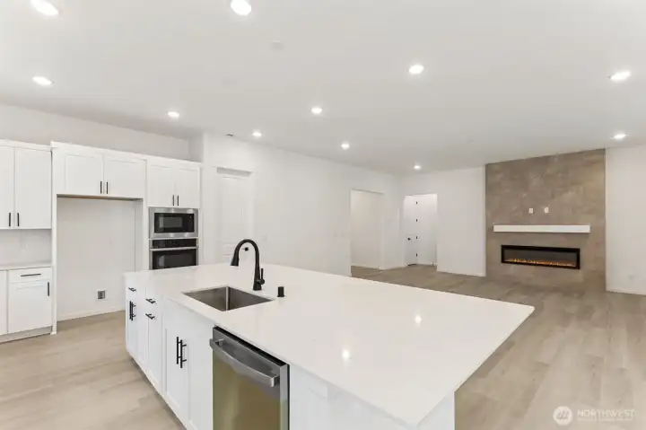 ***Actual Home *** Kitchen area, Great Room with hall to front and Primary suite