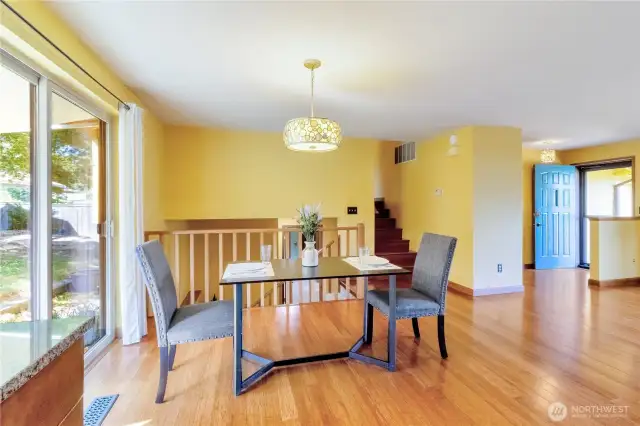 DIning area just off of the kitchen with back patio access.