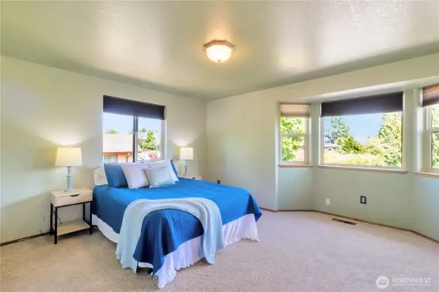 Large primary suite with bay window on the upper level.
