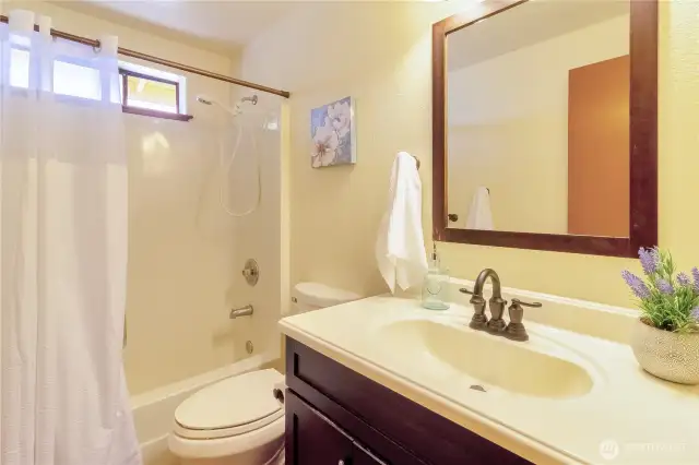 The home's main bathroom is located at the top of the stairs.