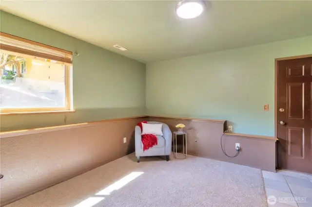 Lower level bedroom with outdoor access.