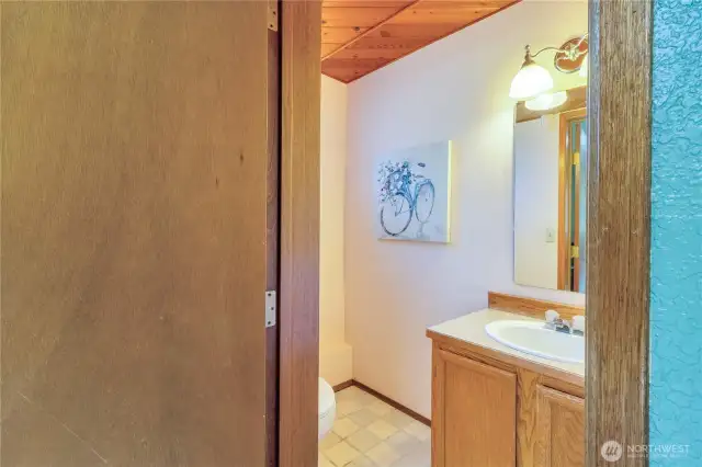 Lower level half bath off of the bedroom.