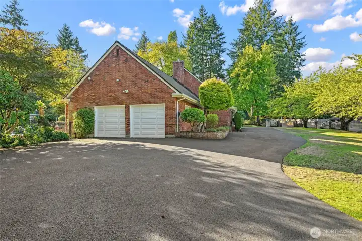 Attached two-car garage surrounded by privacy