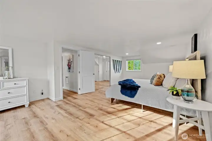 Sunlit and spacious primary bedroom with en-suite