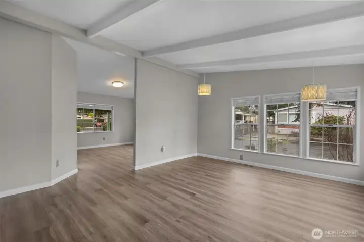 Peering toward the Dining Room from the entryway.  Can you believe all the windows?!  This home is very well lit!