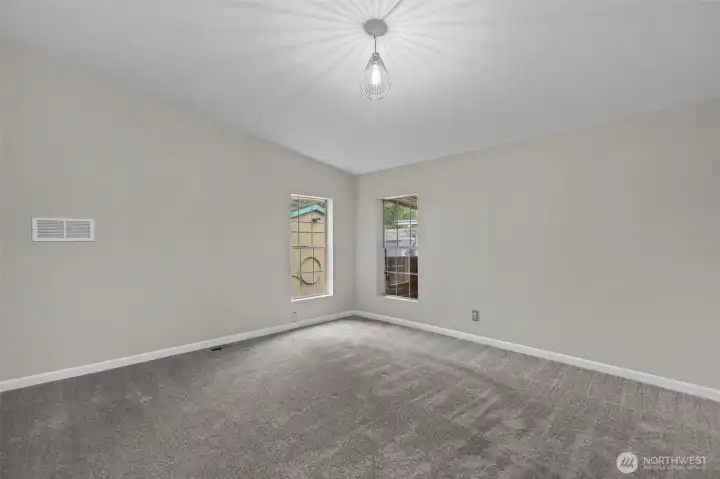 Primary Bedroom has windows on the east wall and the south wall of the room.  Plenty of space for a King Size Bedroom Set.