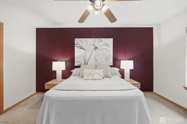 The spacious primary suite enjoys its own private wing, thoughtfully set apart from the other bedrooms for added comfort and quiet.