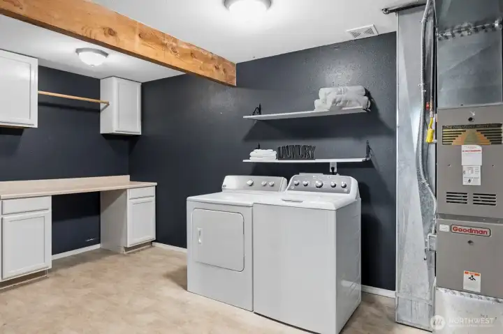 A large, well-appointed laundry room adds everyday convenience, and the included washer & dryer make move-in a breeze