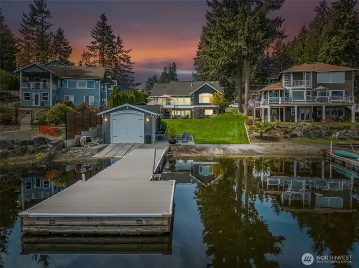 Out here on the water, you really get the full picture, open lake, wide shoreline, and a property that holds its own. And here’s the part people love: no HOA! Also, the daylight basement isn’t just bonus space, it’s a full-on flex level. Two dens,  a bedroom, a bonus room, a dedicated movie theater, and a workout area that can all shift depending on what life throws at you. Multigenerational living, guests who stay a little longer, work-from-home setups, it’s all covered without feeling crowded. There’s also a 200 sq ft unfinished utility and storage room housing the furnace and water heater, giving you real, practical storage space that keeps everything else running smoothly.
