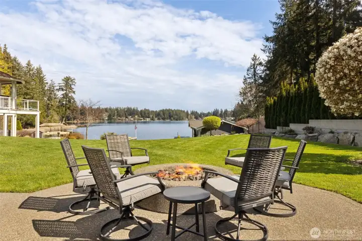 This is the kind of setup that makes you want to stay outside a little longer. From the fire pit, your view stretches across the lawn straight to the water, easy, open, and exactly what you want at the end of the day. And while it looks effortless, it kind of is. The yard is supported by a full sprinkler system plus drip irrigation for the planters, so everything stays lush without you babysitting a hose all summer. There are also raised garden beds ready to go if you’re feeling ambitious… or you can just admire them and call it a win. Low maintenance, high reward.