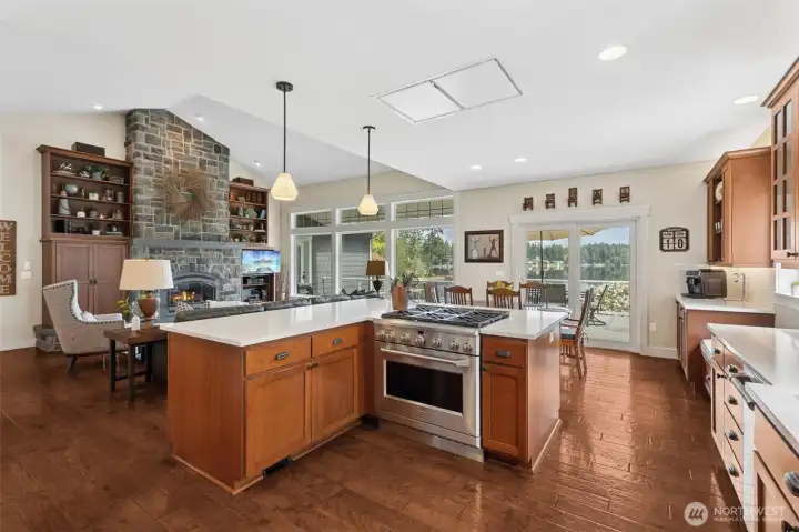 This is where form meets function and then casually throws in a view. The gas oven and cooktop combo is ready for anything, while the sightline out to the lake keeps things interesting even during prep work. It’s a kitchen that keeps you connected, not tucked away. Down below, the toe-kick central vac makes cleanup almost too easy, quick sweep and it’s handled. And because one fridge is never enough here, the added beverage fridge steps in to keep everything flowing smoothly when the house fills up.