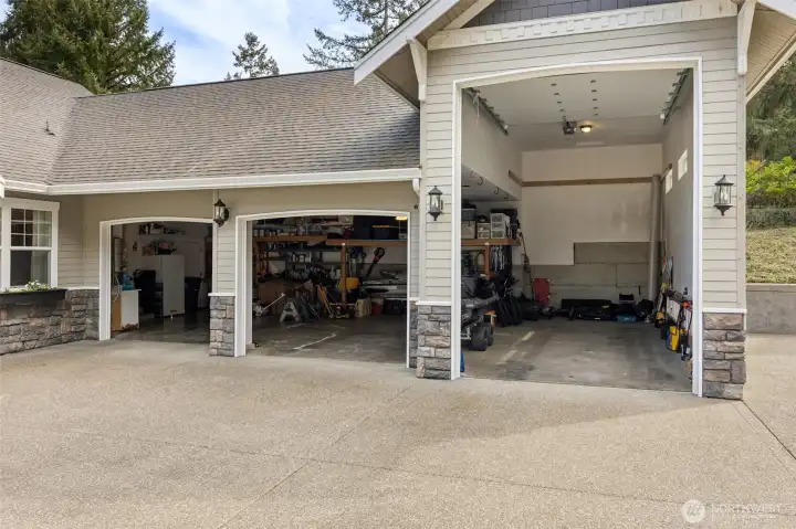 All doors open and you can see just how much space you’re working with, especially that RV bay with the extra height that makes oversized storage feel easy instead of impossible. The additional two bays are generous on their own, so cars, toys, tools, it all fits without the usual shuffle. And yes, there’s a utility sink out here, which sounds small until you’ve had one. Cleanup happens before anything tracks inside, whether it’s muddy shoes, lake gear, or a weekend project gone slightly sideways. It’s functional, flexible, and built for real life.