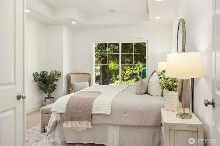 Main Level Bedroom with generous natural light and ample closet space for comfort and convenience