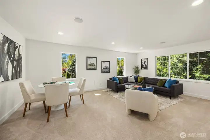 Main-Level Versatile bedroom or den with elegant French doors, oversized windows, and a spacious closet—ideal for work or relaxation