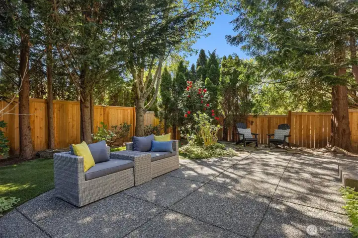 Beautifully landscaped grounds create a peaceful outdoor setting perfect for relaxing or entertaining.