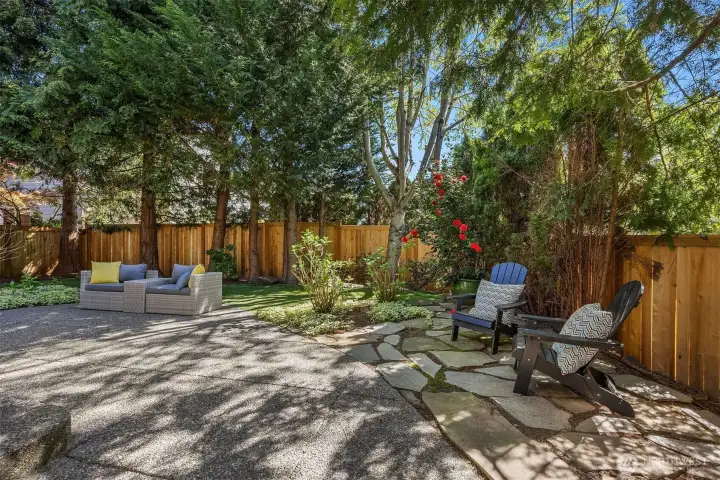 Tranquil, private backyard oasis with lush, mature landscaping that provides beauty and exceptional privacy year-round