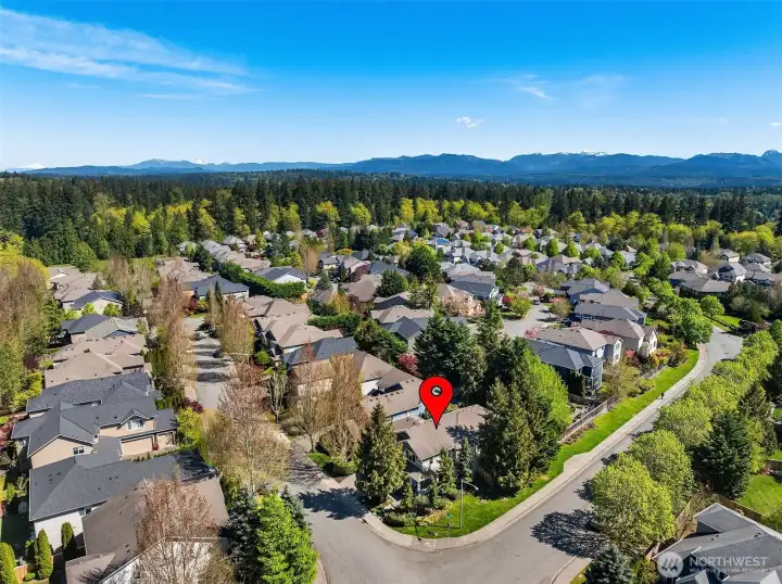 Situated on a coveted private corner lot, offering enhanced privacy, space, and curb appeal