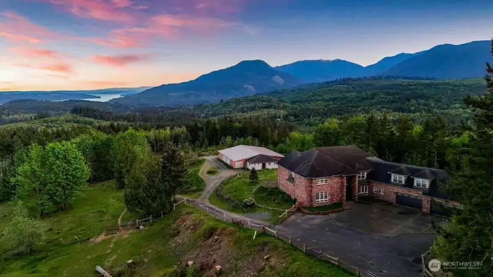 Home is situated on 20 acres with views to the South of Quilcene Bay, Hood Canal and the Olympic Mountains.