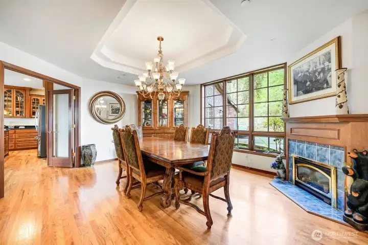 Formal dining room with fireplace.