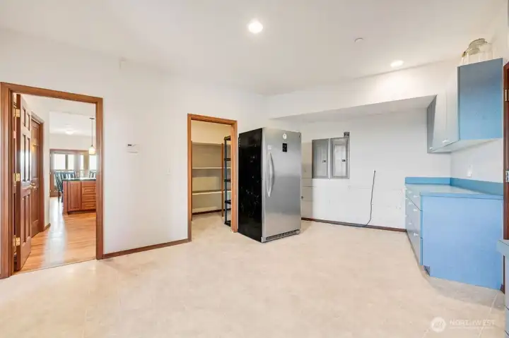 Butlers kitchen with walk-in pantry. Additional cabinetry with counter space, 2 built-in dishwashers and garage entry, not shown.