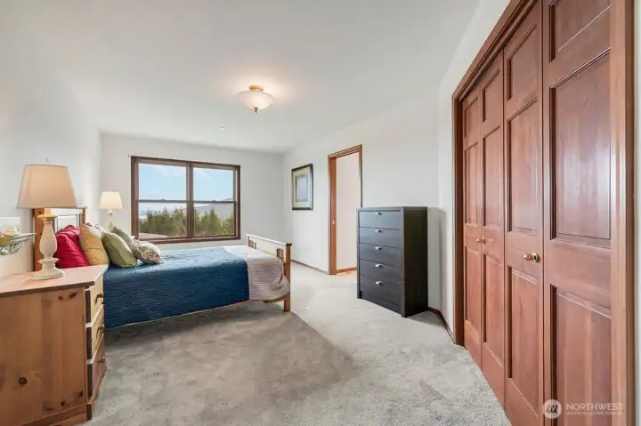 Second bedroom with full bath and view of Quilcene Bay and the Olympic Mountains.