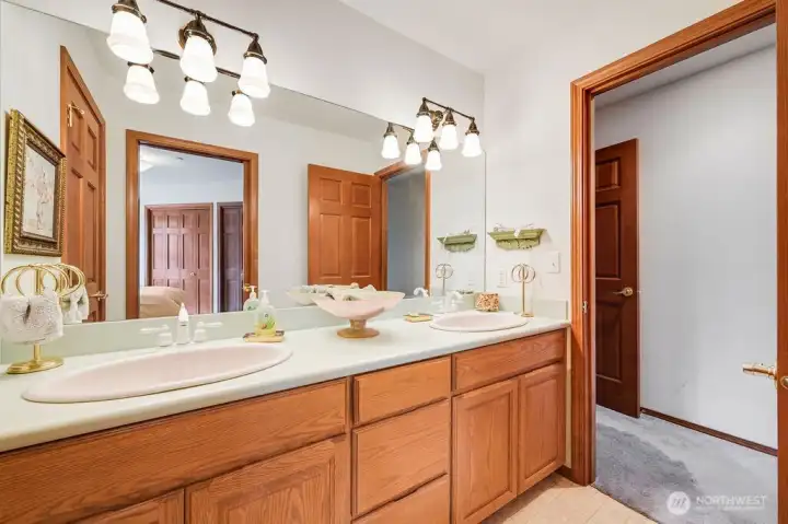 Full bath with access to the third bedroom. You can also access from the hallway off entertainment room.