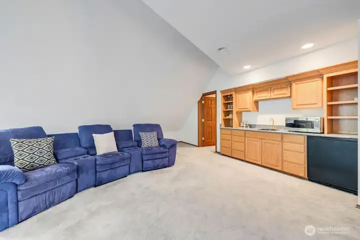 Entertainment room with wet bar.