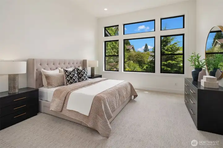 Designer primary suite with five-piece bath with heated floors