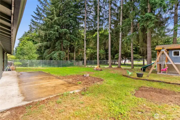 Large, level fully fenced back yard.
