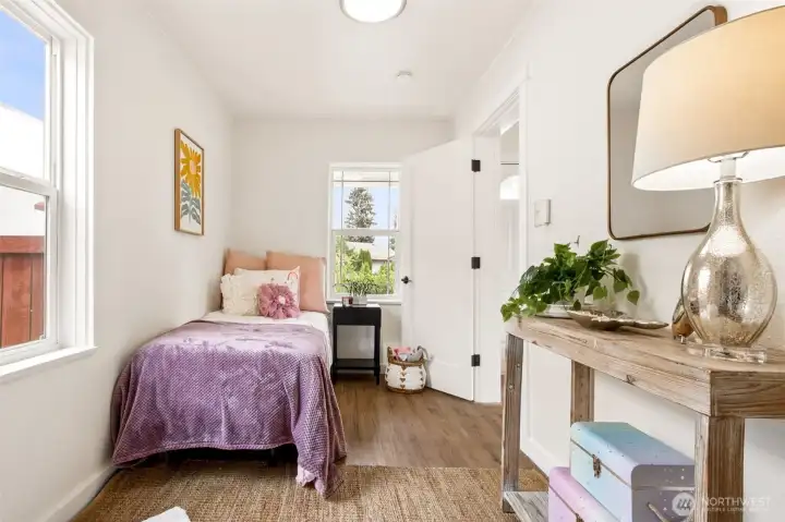This main-level bedroom offers flexibility for guests, a home office, or hobbies. Soft natural light makes it a comfortable, versatile space. This main-level bedroom offers flexibility for guests, a home office, or hobbies. Soft natural light makes it a comfortable, versatile space.