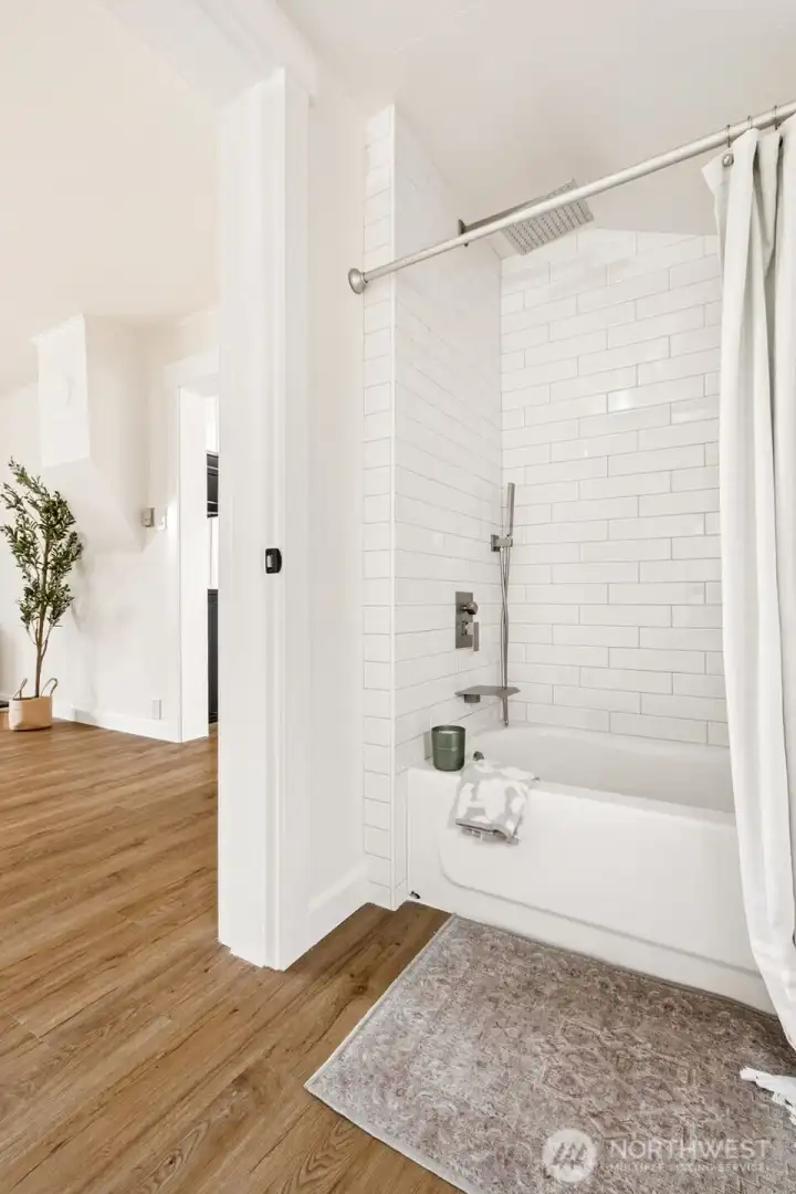 Beautifully updated full bath with new tile tub surround, modern finishes and a clean, neutral palette. Move-in-ready and designed for everyday convenience. Beautifully updated full bath with new tile tub surround, modern finishes and a clean, neutral palette. Move-in-ready and designed for everyday convenience.