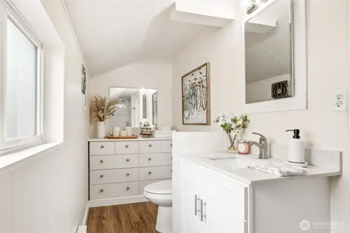 The full bath blends fresh updates with the home’s original 1900 charm. New cabinetry, quartz counters, and practical built-in storage add modern function while thoughtfully preserving the vintage character that makes this home so special. The full bath blends fresh updates with the home’s original 1900 charm. New cabinetry, quartz counters, and practical built-in storage add modern function while thoughtfully preserving the vintage character that makes this home so special.