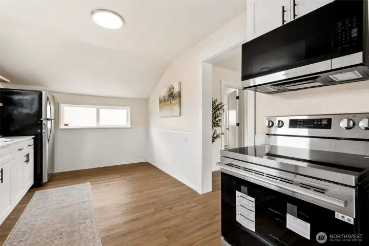 The kitchen offers an inviting spot for a small table, creating a cozy nook for morning coffee, easy meals, or catching up with family while cooking. The kitchen offers an inviting spot for a small table, creating a cozy nook for morning coffee, easy meals, or catching up with family while cooking.