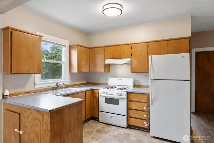 Unit 2305 kitchen features gas stove. Unit 2305 kitchen features gas stove.