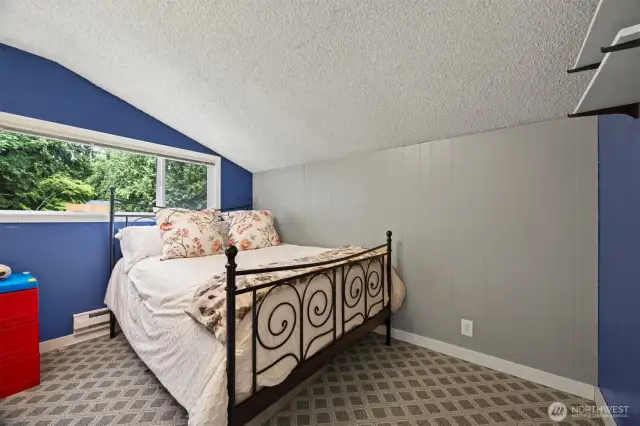 This bedroom looks down onto the swimming pool and is nicely sized, as well.