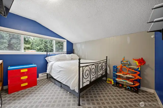 This bedroom looks down onto the swimming pool and is nicely sized, as well.