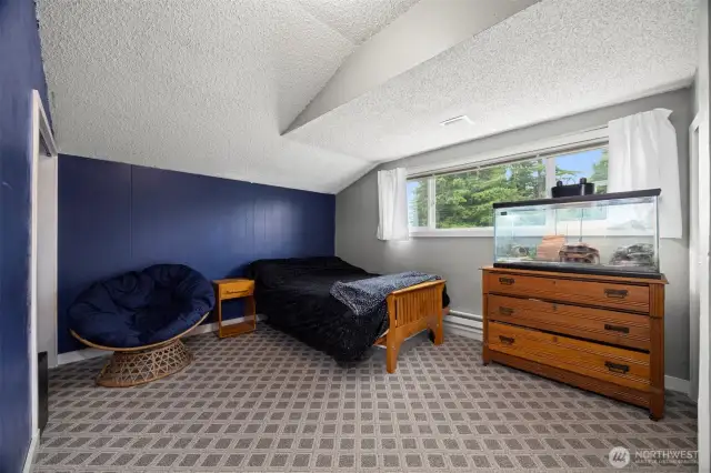 This bedroom overlooks the front lawn and is also quite large.